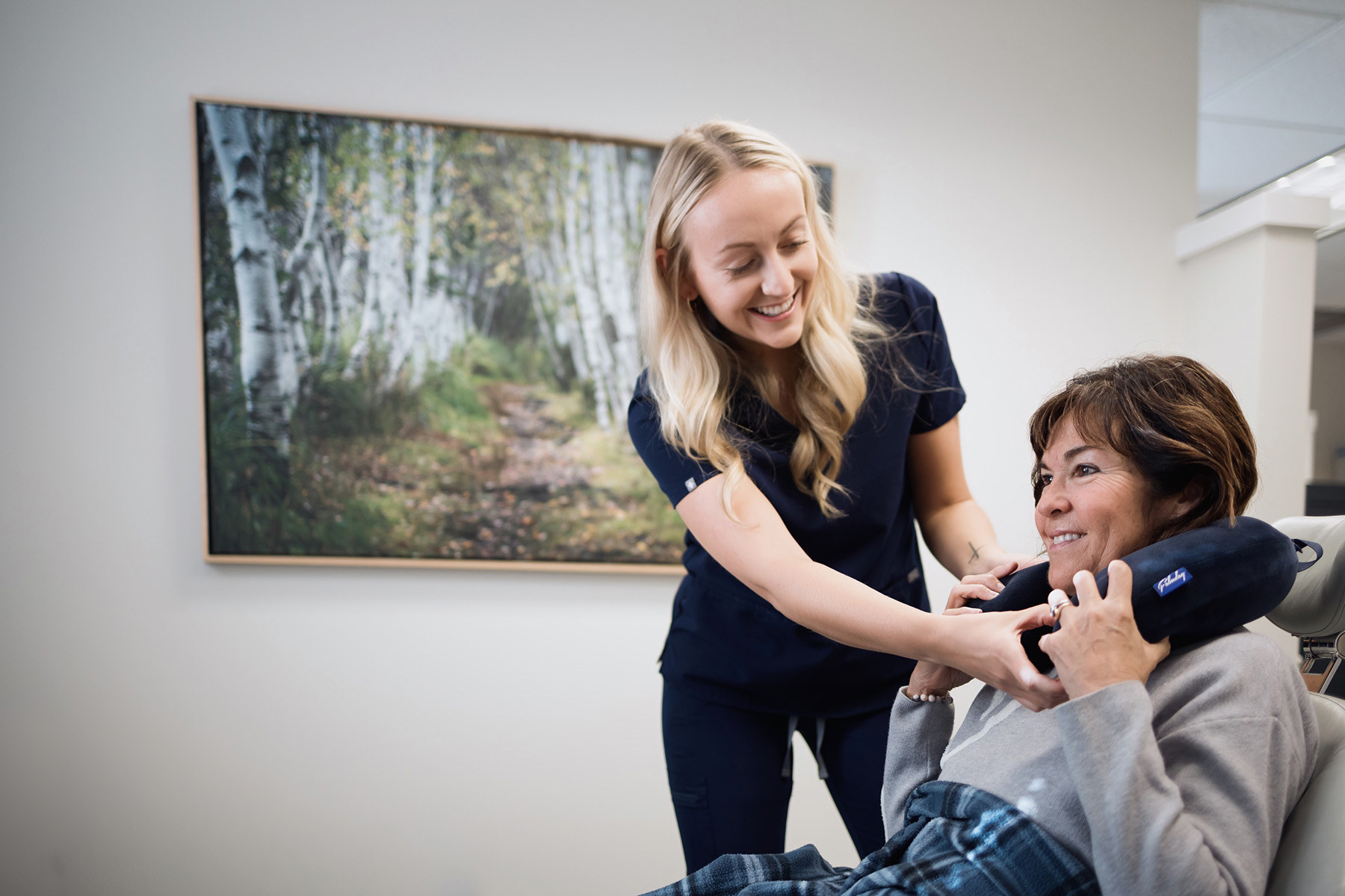 Dentist with patient reviewing X-ray