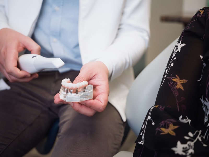 Dr. McVety explaining the dental implant process